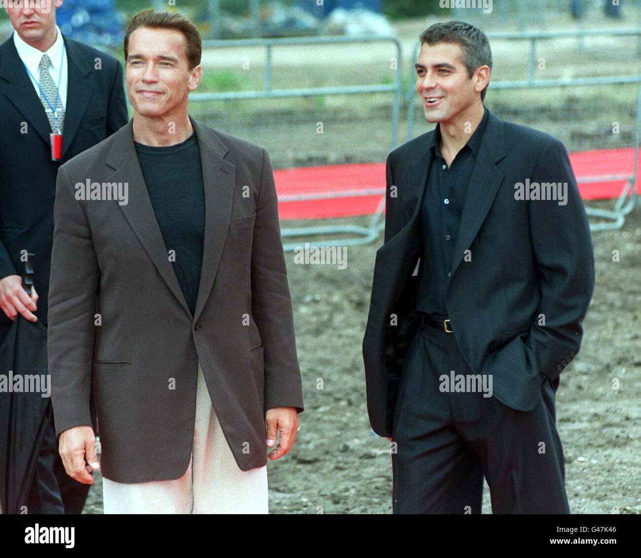 Stars of the new Batman movie, Arnold Swartzenegger (left) and George Clooney outside the Battersea Power Station in London this morning (Monday) where they were backing today's announcement that it is to be converted in to one of the world's largest multi-screen cinemas. The 20 million Powerplex will be run by Warner Village Cinemas and will open early in the year 2000. See PA story SHOWBIZ Battersea. Photo by Stefan Rousseau/PA. Stock Photo