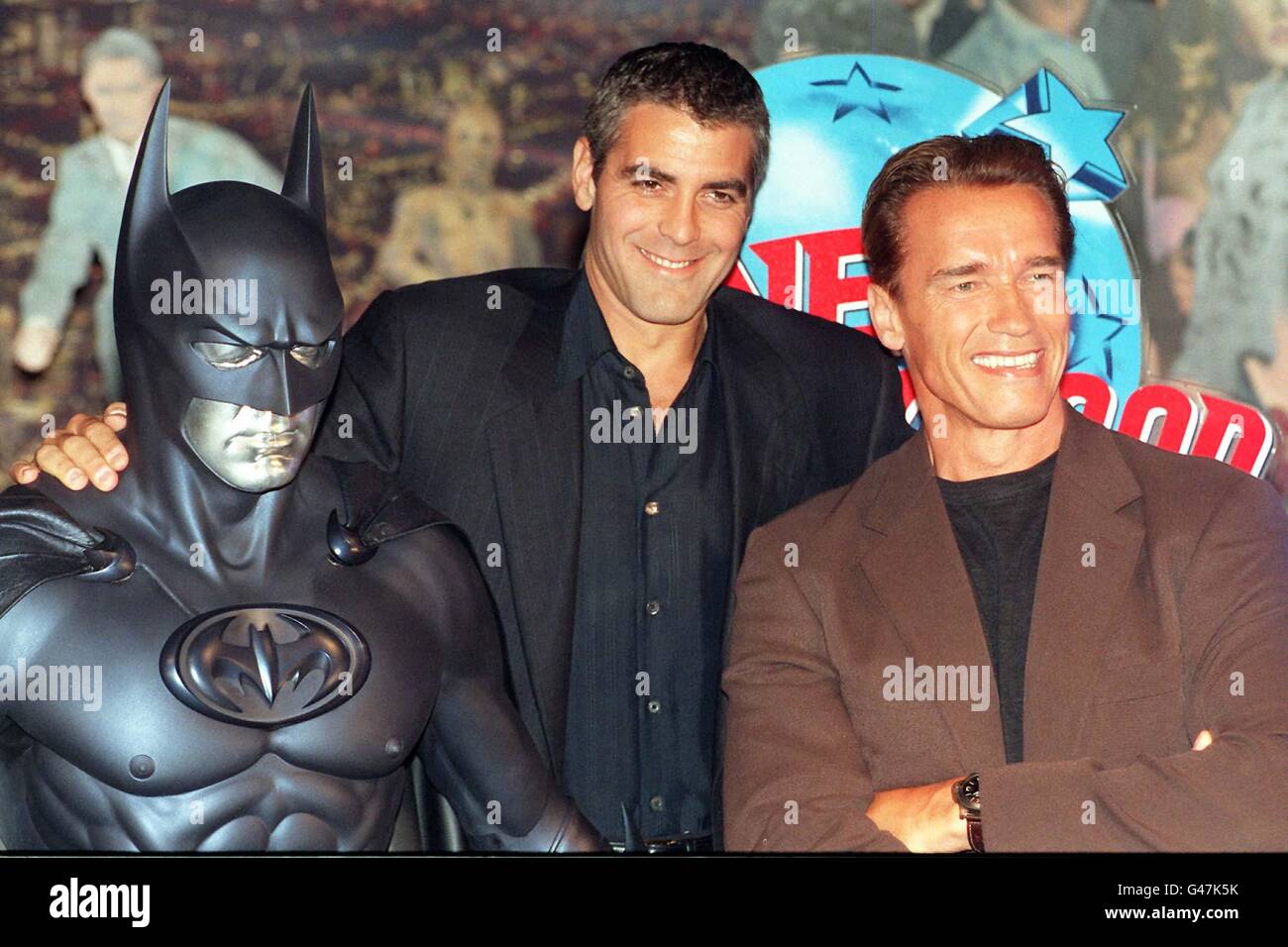 Heart throb American actor, George Clooney (left), and action movie hero, Arnold Schwartzenegger at Planet Hollywood, in London today (Monday), promoting their latest Batman movie. Clooney plays the title role with Schwartzenegger playing Mr Freeze. Photo by Stefan Rousseau/PA. see PA story SHOWBIZ Battersea. Stock Photo