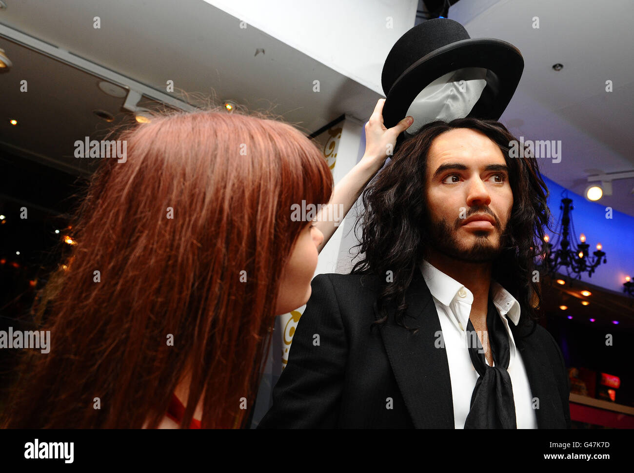 Amy Williams puts the finishing touches to the Russell Brand waxwork to celebrate his role in the upcoming movie Arthur, a remake of the Dudley Moore film, at Madame Tussards in London. Stock Photo