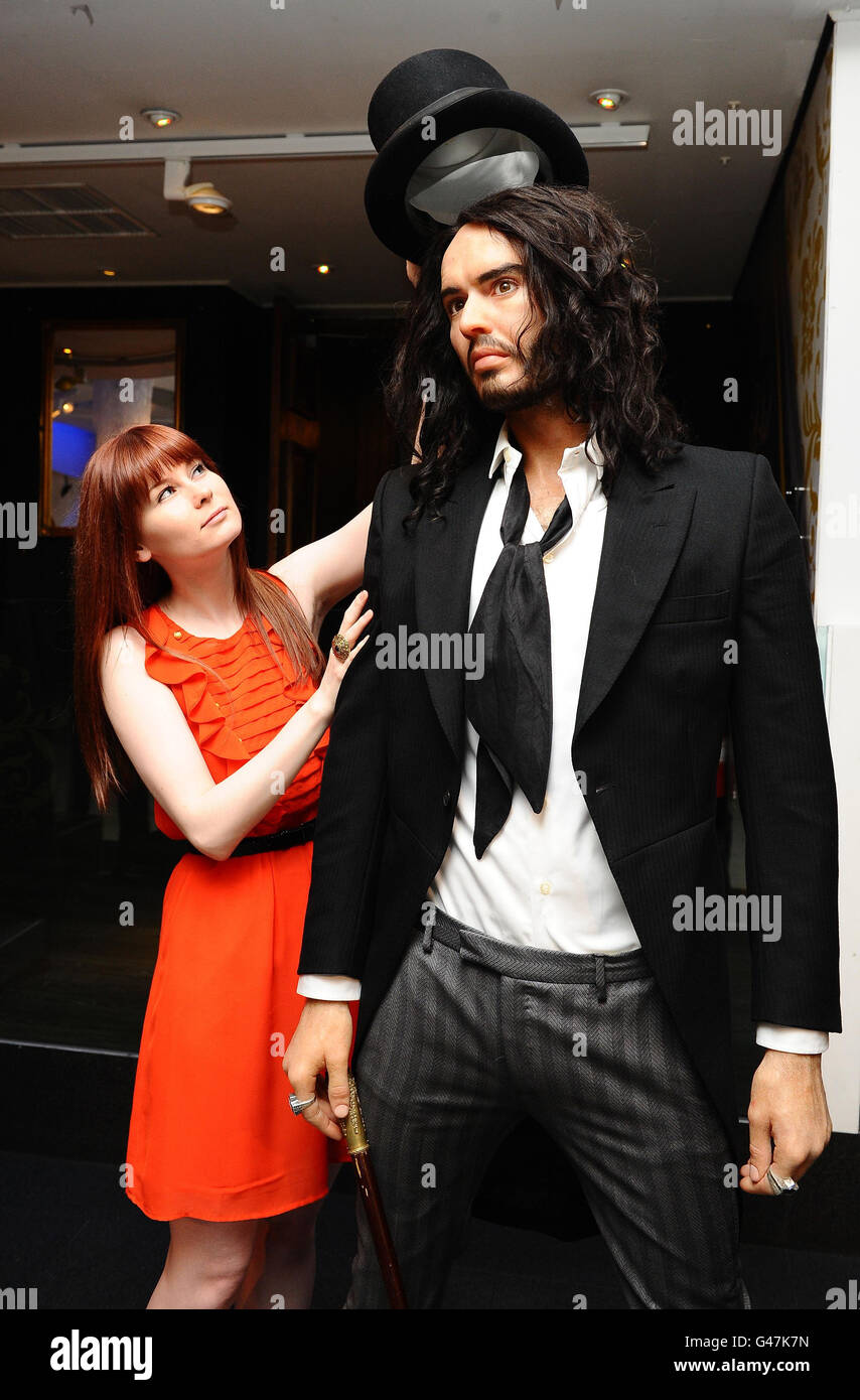 Amy Williams puts the finishing touches to the Russell Brand waxwork to celebrate his role in the upcoming movie Arthur, a remake of the Dudley Moore film, at Madame Tussards in London. Stock Photo