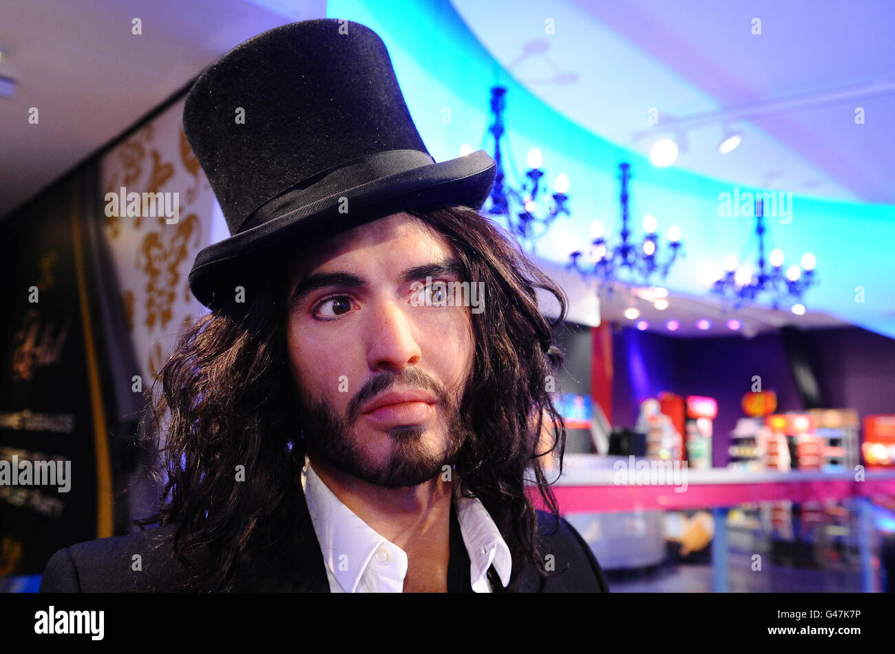 The Russell Brand waxwork at Madame Tussards in London, is dressed in top hat, cane and black dinner jacket to celebrate his role in the upcoming movie Arthur, a remake of the Dudley Moore film. Stock Photo