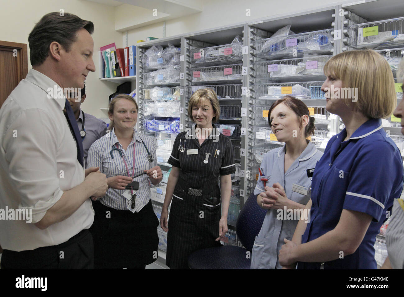 Britain's Prime Minister David Cameron talks to hospital staff at Frimley Park Hospital. Stock Photo