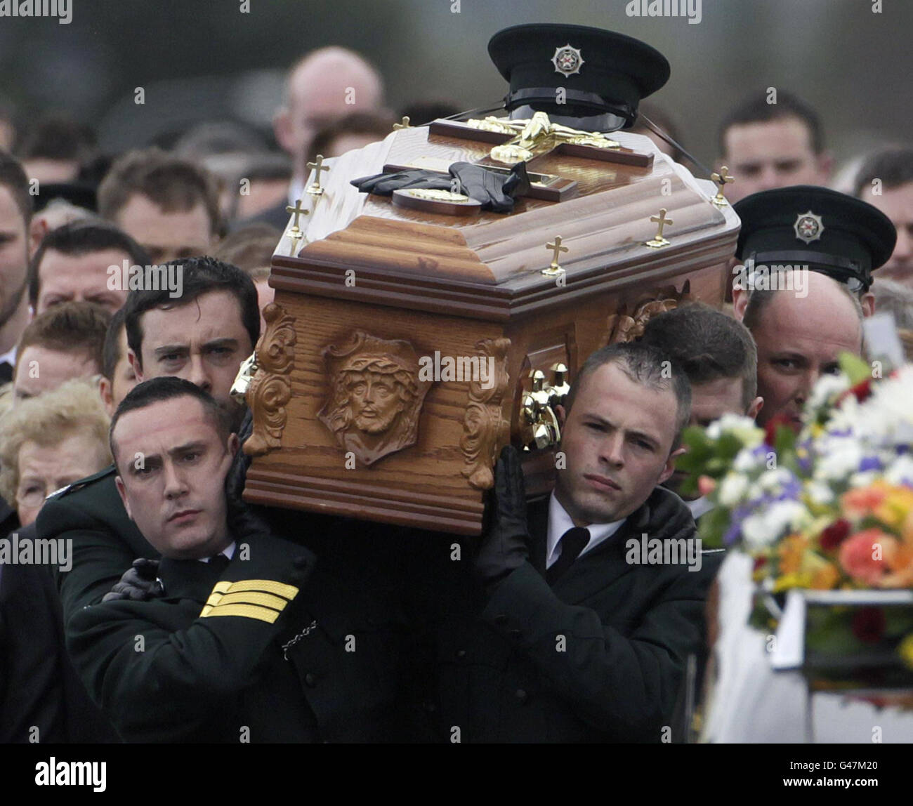 The coffin of PSNI Constable Ronan Kerr is carried through his home ...