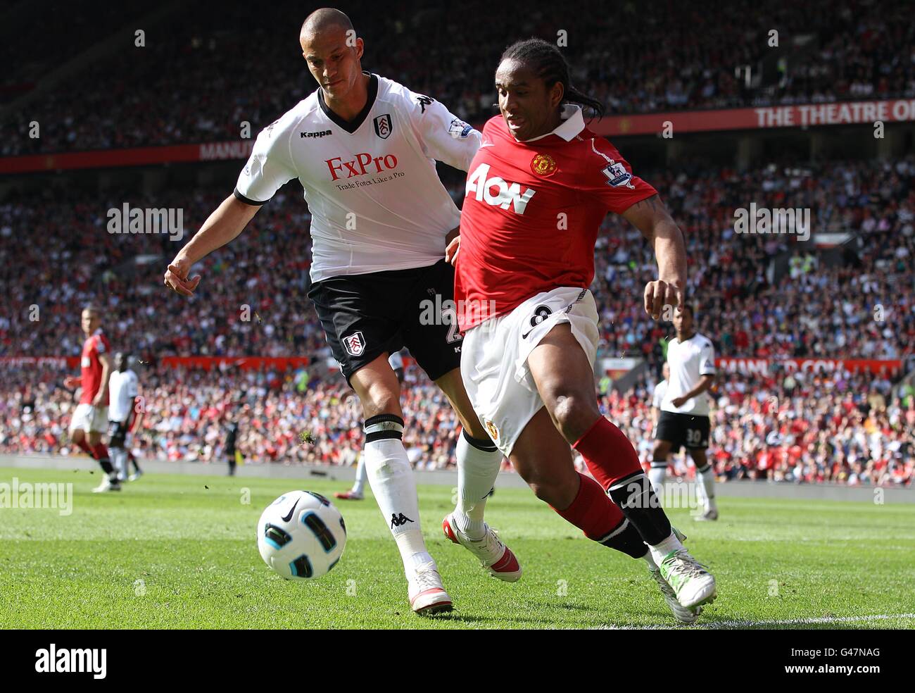 Soccer - Barclays Premier League - Manchester United v Fulham - Old Trafford. Manchester United's Oliveira Anderson (right) and Fulham's Bobby Zamora (left) battle for the ball Stock Photo
