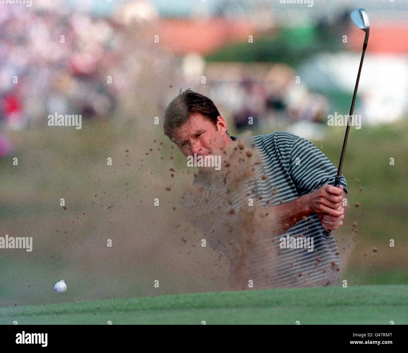 England's Nick Faldo uses his sand wedge to good effect to escape a bunker on the 4th during 126th Open Championship at Royal Troon 2nd round this morning (Friday). Photo by Adam Butler/PA. Stock Photo