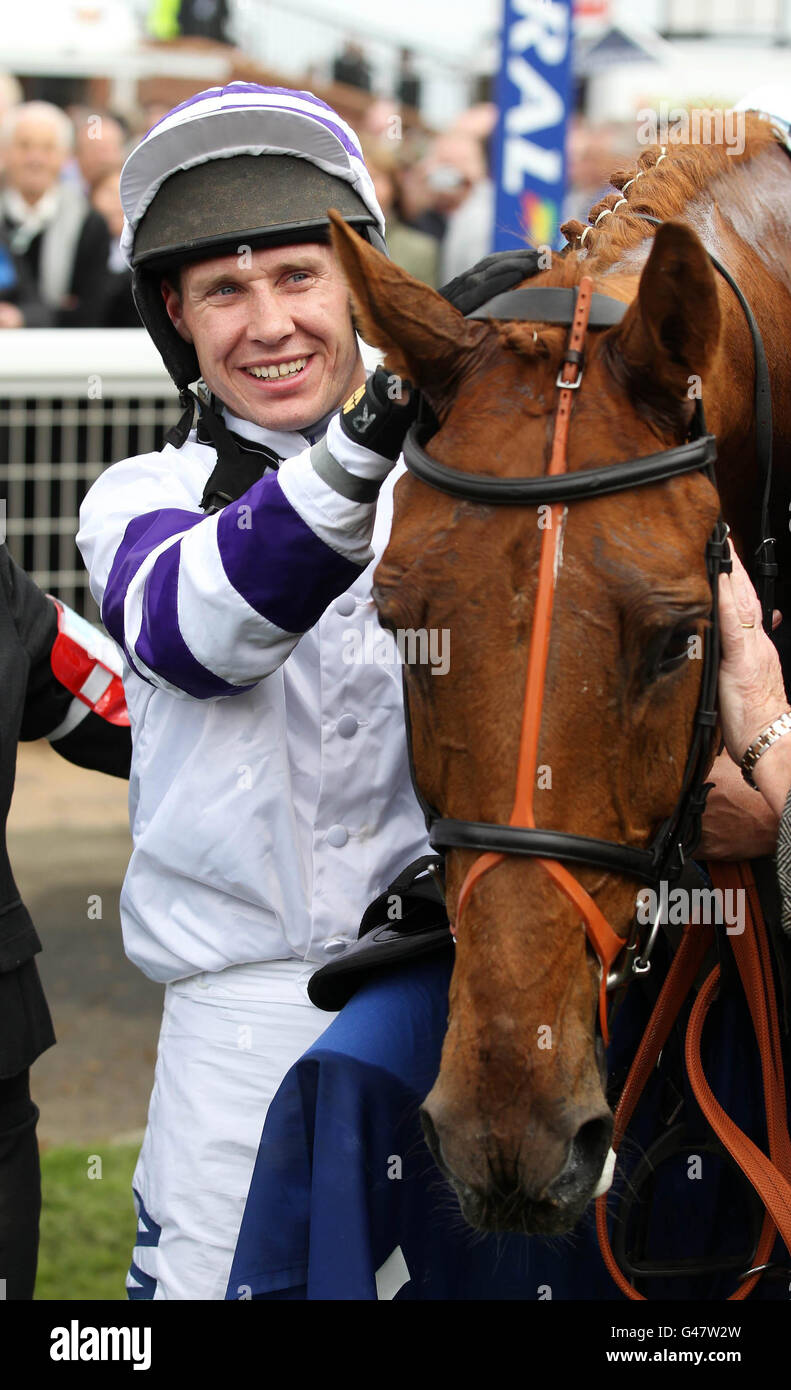 Beshabar with jockey Richard Johnson after winning the The Coral Scottish Grand National Handicap Steeple Chase during day one of the Coral Scottish Grand National Festival at Ayr Racecourse, Ayr. Stock Photo