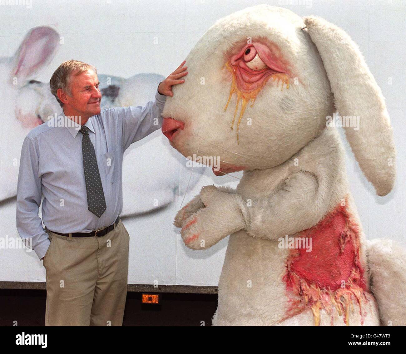 Richard Briers comforts 'Vanity' the rabbit at the launch of a new campaign by the British Union for the Abolition of Vivisection (BUAV) today in London. The campaign is promoting an internationally agreed standard for cosmetics that have not been tested on animals, being launched in London, Brussels and Los Angeles today. Photo by Ben Curtis/PA. Watch for PA Story. Stock Photo