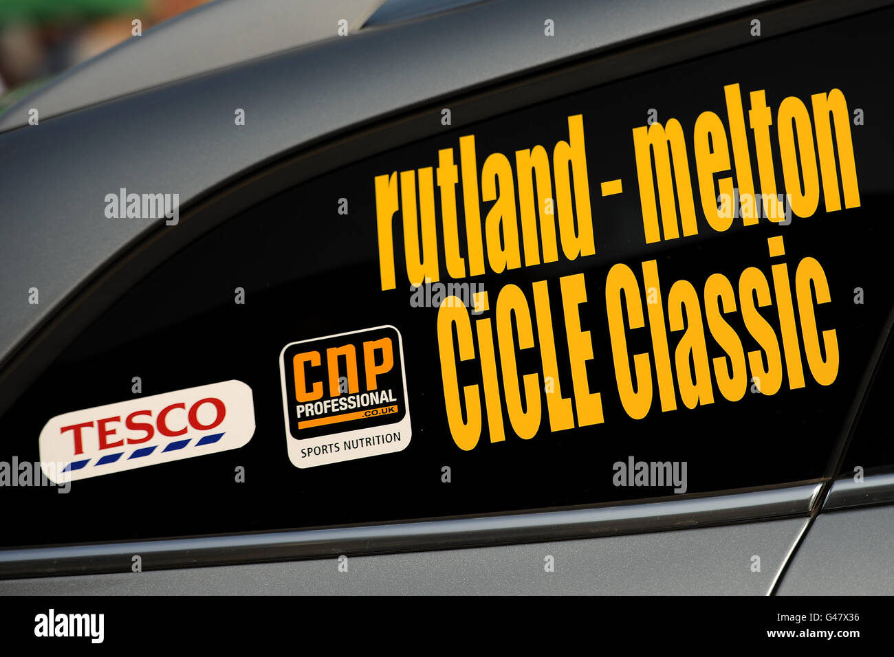 Cycling - Tesco Rutland - Melton International CiCLE Classic. Detailed view of signage for Tesco and CNP Professional on the side of a CiCLE Classic official car Stock Photo