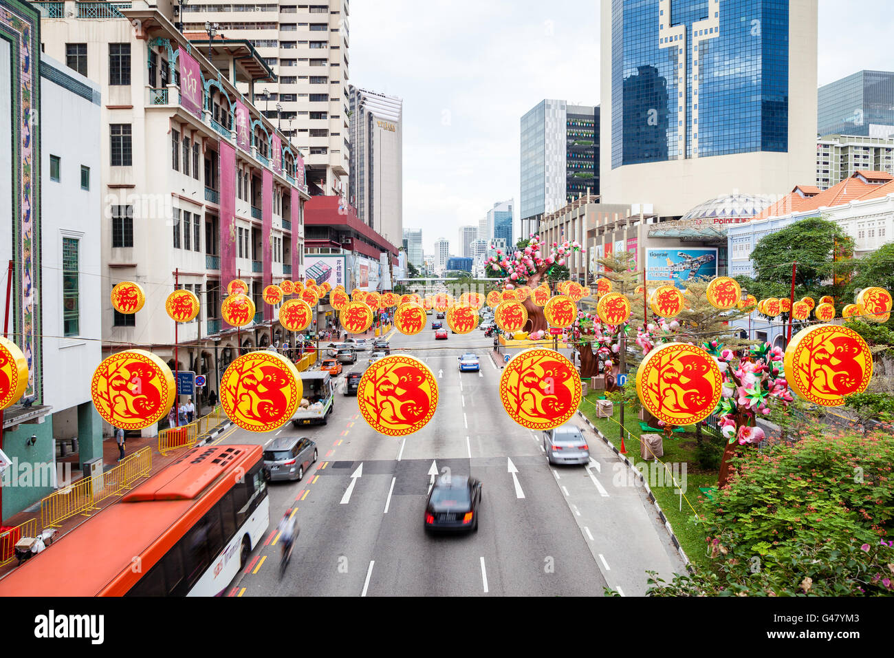 Singapore  - January 17, 2016: Colorful decorations hang over the streets in Chinatown to celebrate Chinese New Year. Stock Photo