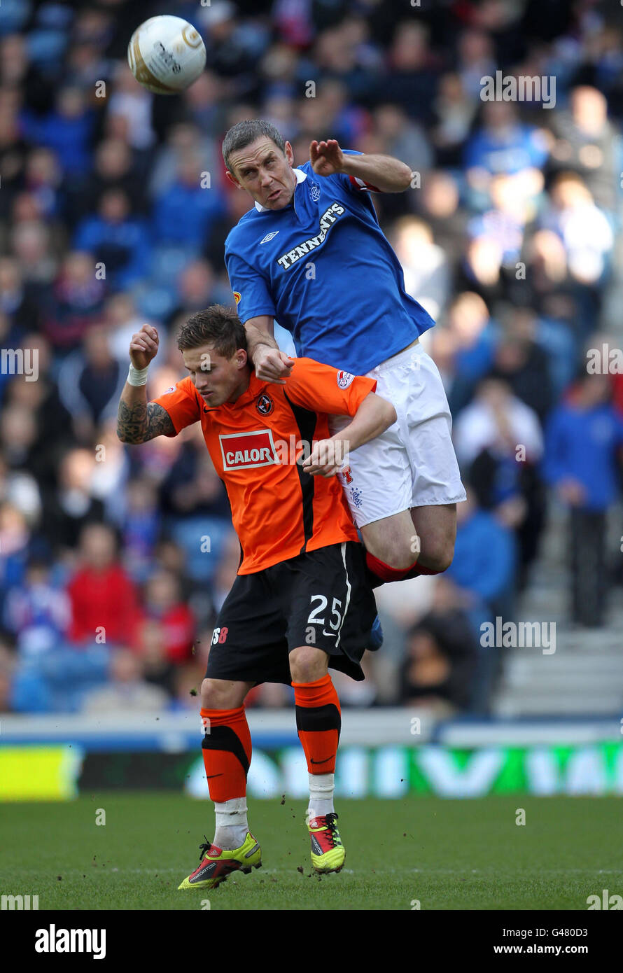 Rangers' David Weir and Dundee United's David Goodwillie during the Clydesdale Bank Scottish Premier League match at Ibrox Stadium, Glasgow. Stock Photo