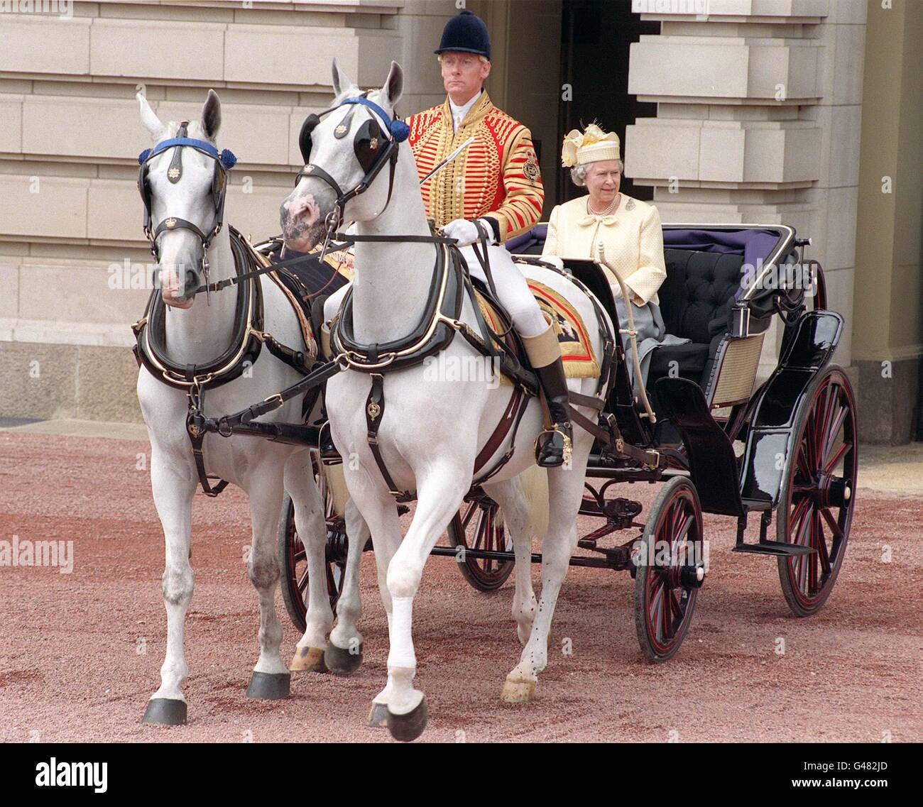 The Queen rides out of Buckingham Palace in an open carriage this morning (Saturday) on her way to Horse Guards Parade for Trooping the Colour. The annual ceremony is held to celebrate the Queen's official birthday. Photo by John Stillwell/PA/WPA ROTA. SEE PA STORY ROYAL Trooping. Stock Photo