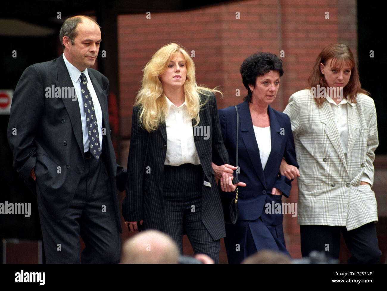 Tracie Andrews (centre left) leaves Birmingham Crown Court today (Monday) with her mother Irene Carter (centre right), sister Donna Carter and step father Alan Carter. Miss Andrews is charged with the murder of her boyfriend Lee Harvey. Picture by DAVID JONES/PA. See PA story COURTS Tracie. Stock Photo