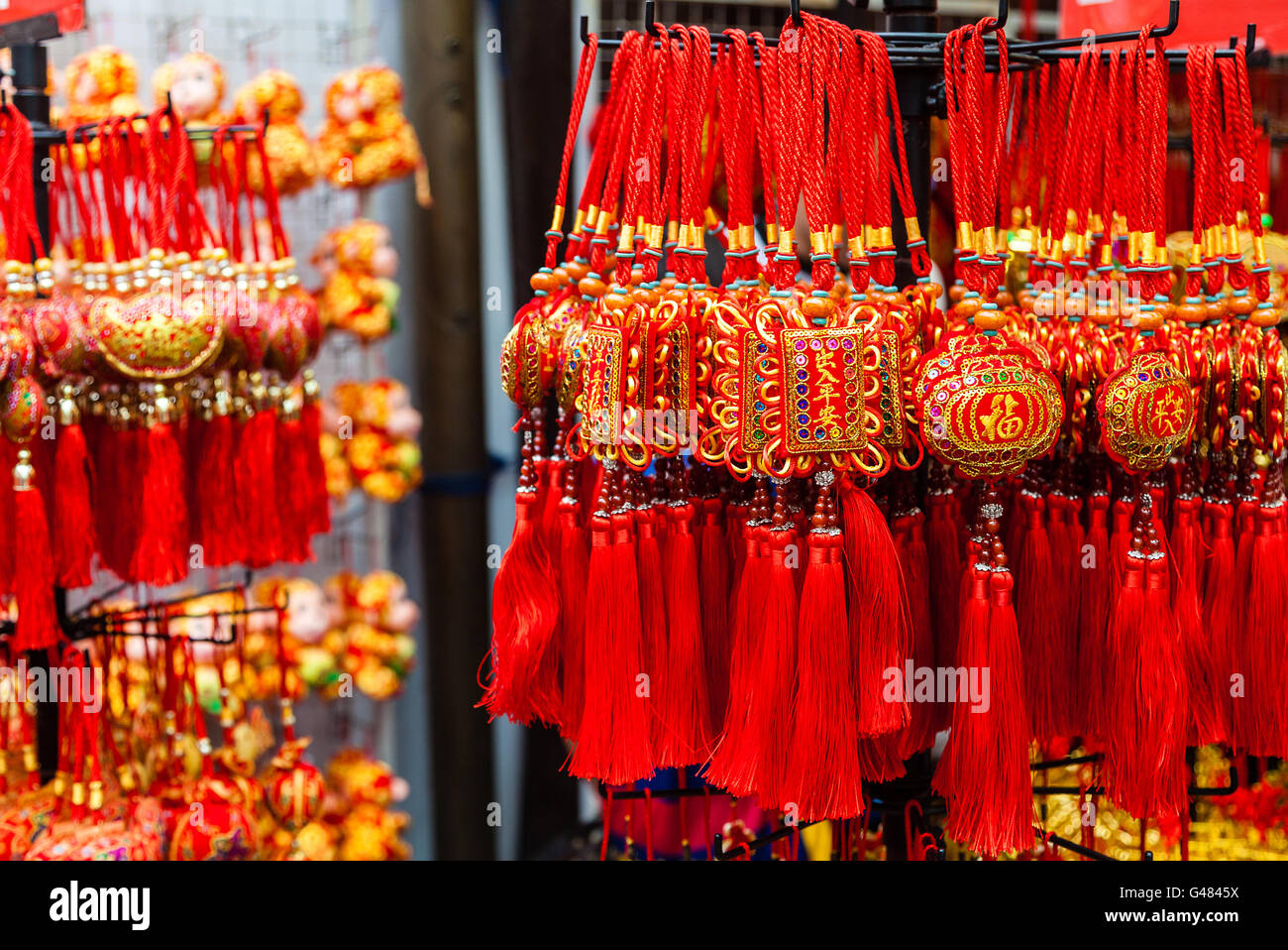 Chinese New Year ornaments on sale in Chinatown. These common ornaments have the Chinese words meaning Blessings and Peace Stock Photo