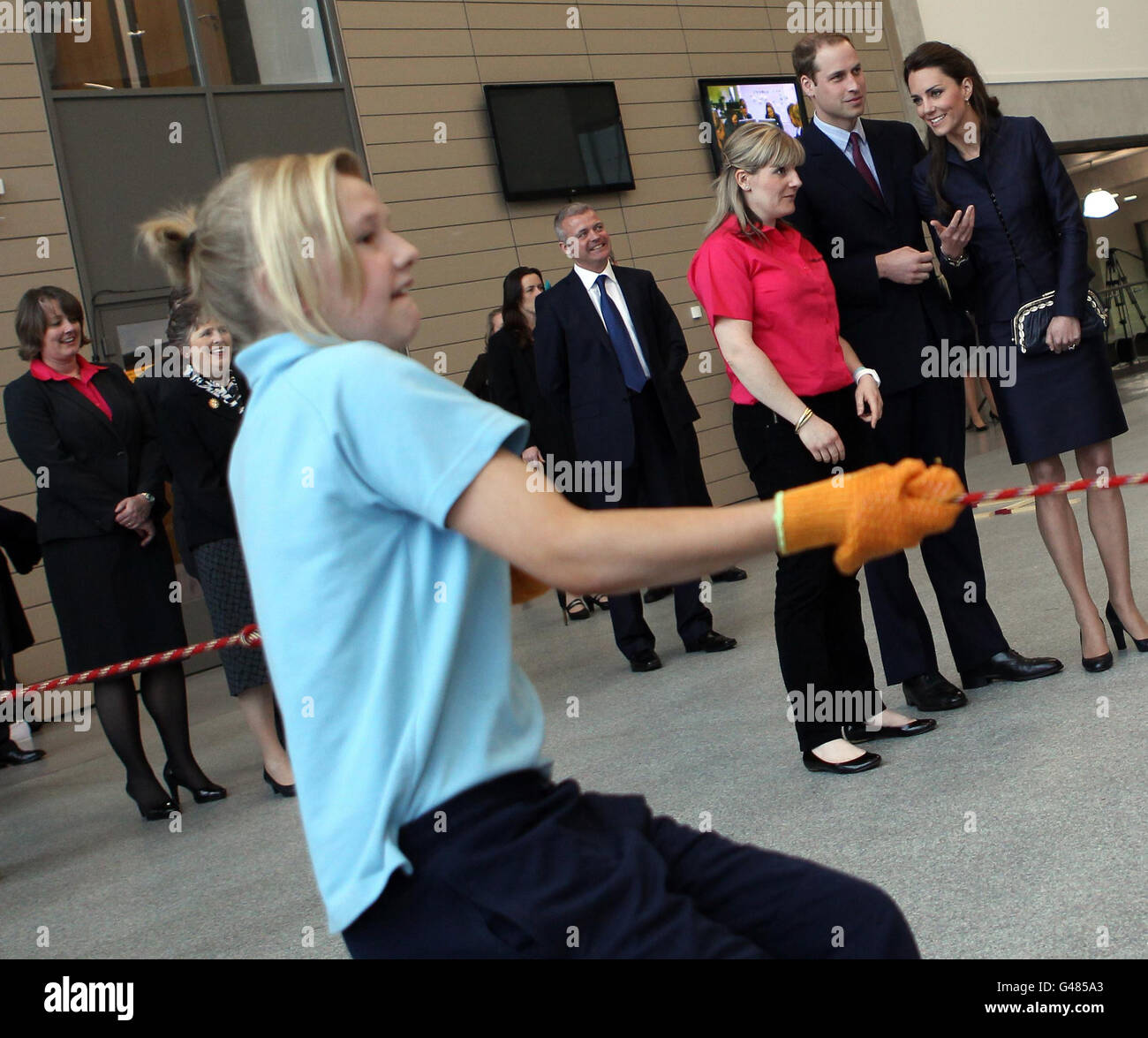 Prince William (2nd right) and his fiancee Kate Middleton (right) watch students demonstrate a physical exercise during their visit to Darwen Aldridge Community Academy in Darwen, Lancashire. Stock Photo