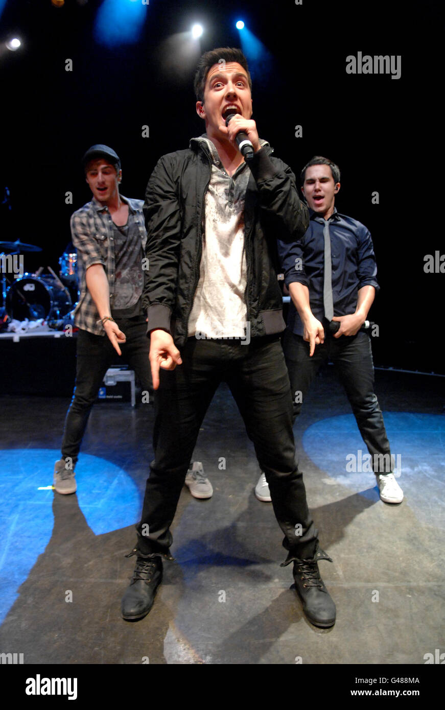 Big Time Rush (from left to right) Kendall Schmidt, Logan Henderson and Carlos Pena, perform on stage at Shepherd's Bush Empire in west London. Stock Photo