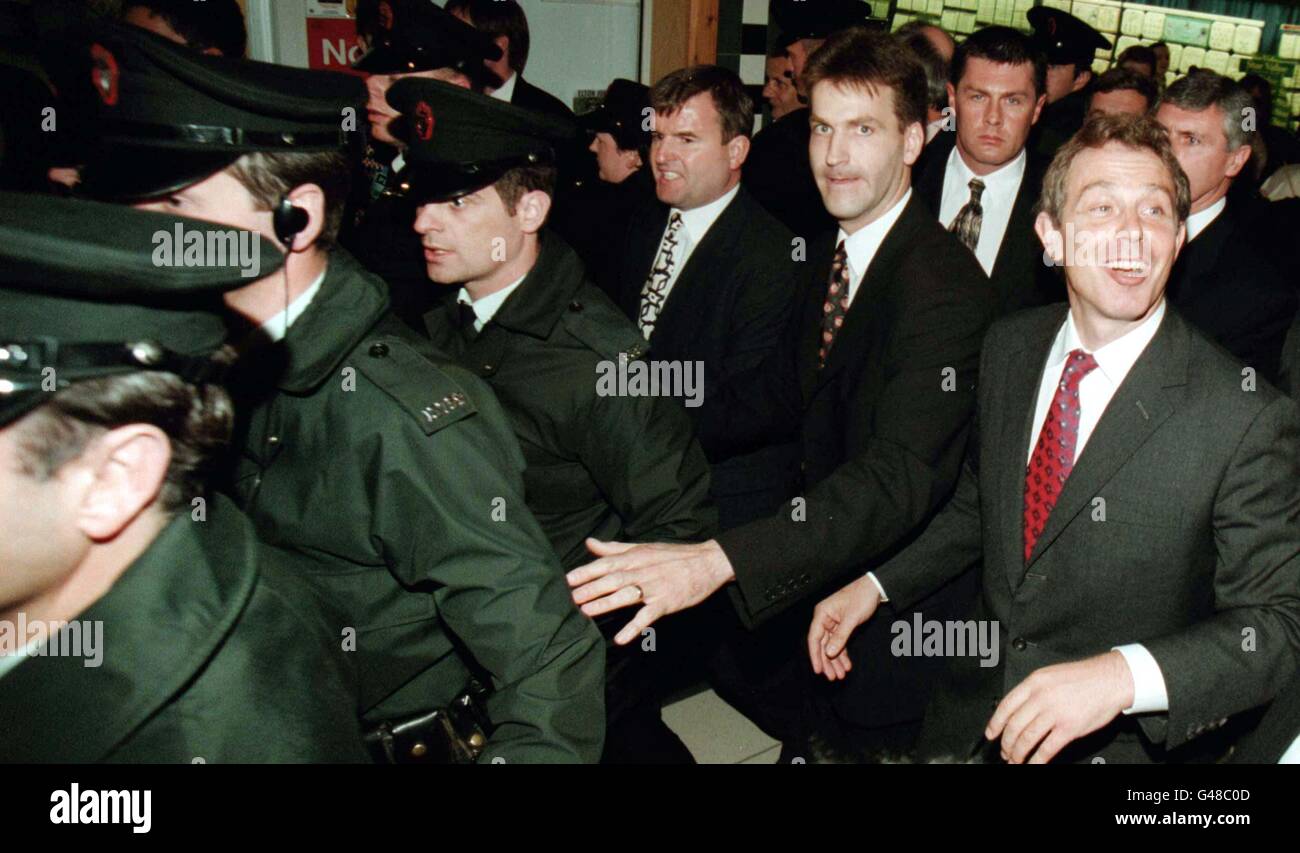 British Prime Minister, Tony Blair (right) puts on a brave face as he