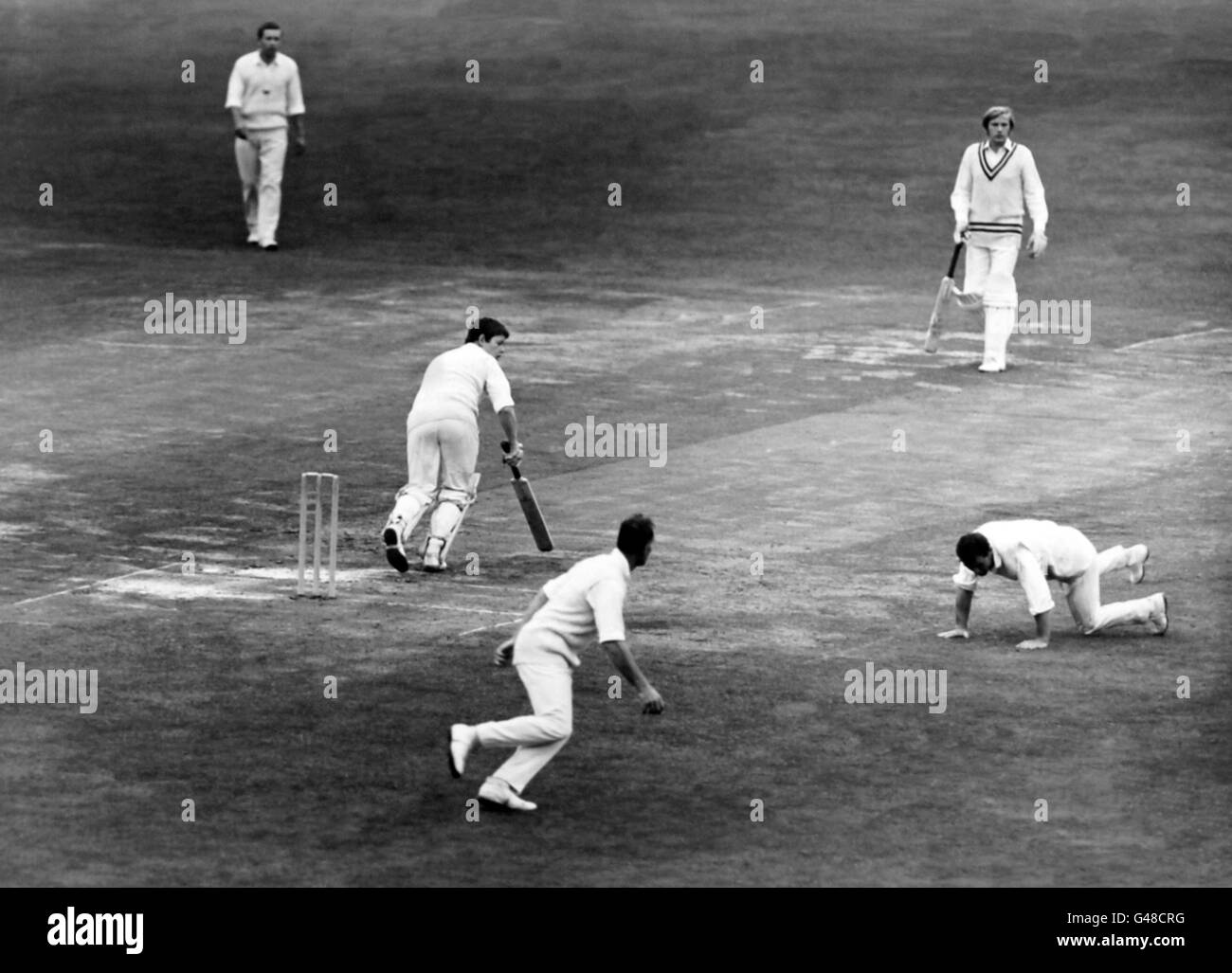 George McMeekin turns O.A.I.R. Robert Healey round to leg where P/O M.J Robinson attempts to field. Stock Photo