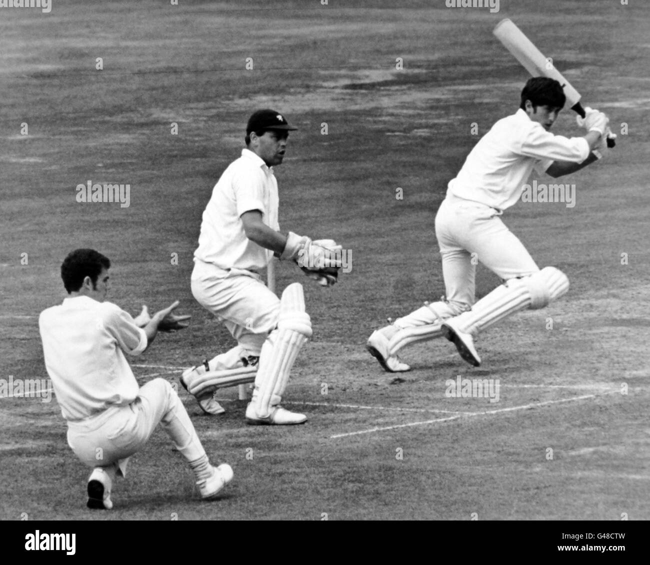 Norman Featherstone, Middlesex, cuts a ball for Peter Robinson, down to short third man for a single. Roy Virgin is the wicket keeper, and Greg Chappell at slip Stock Photo