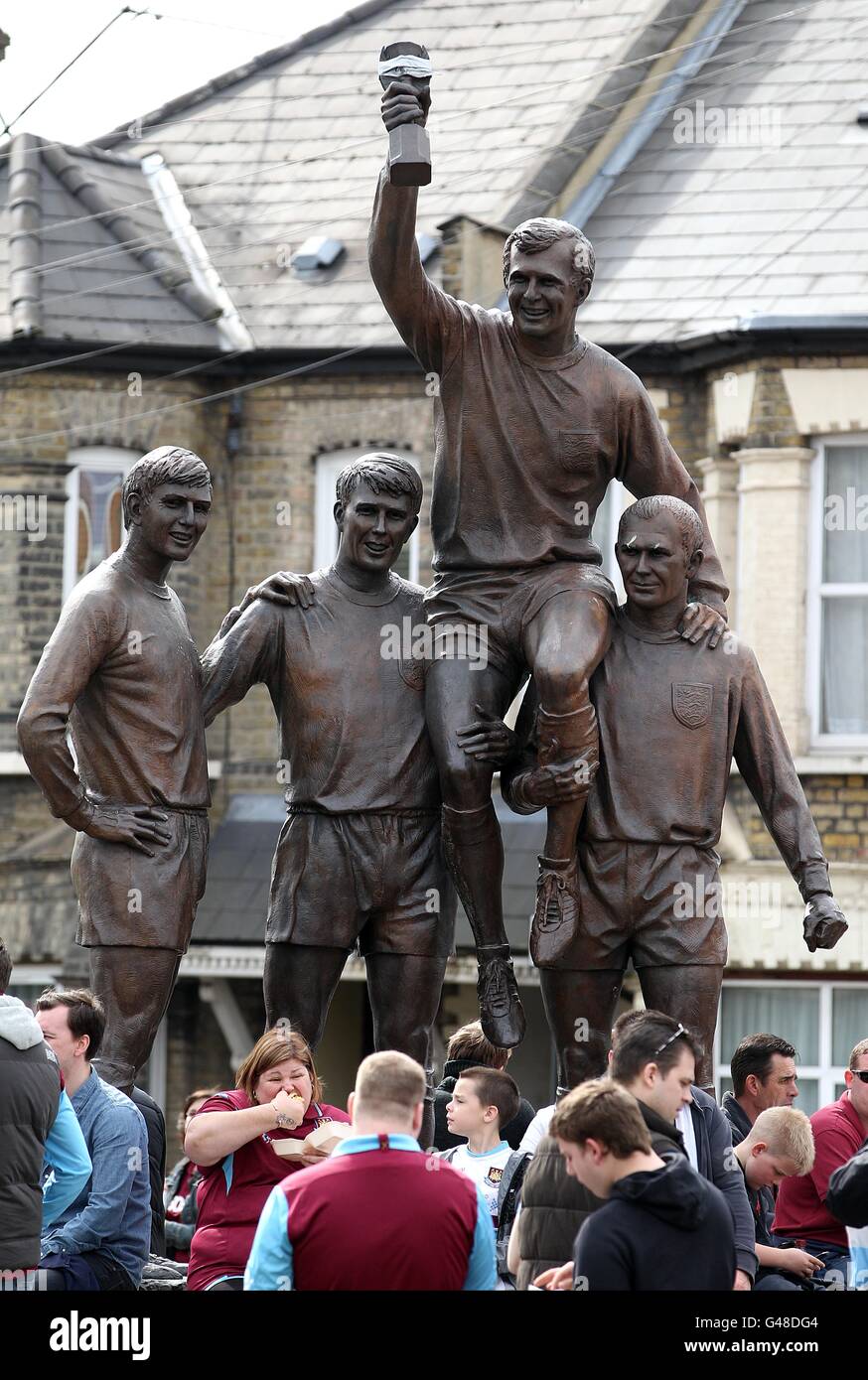 General view of the 'Champions' statue located at the top of Green Street not far from Upton Park. This features Geoff Hurst, Martin Peters and Ray Wilson holding Bobby Moore aloft. Stock Photo