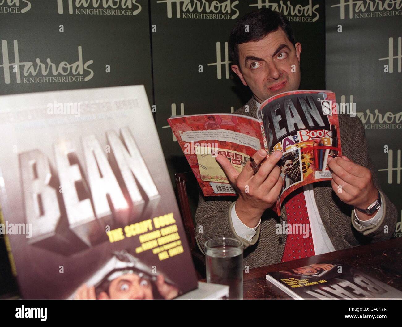 Mr Bean, alias Rowan Atkinson, signs copies of his new book, released to coincide with the launch of the film 'Mr Bean - The Ultimate Disaster Movie', which premieres in the UK on 5th August. See PA story SHOWBIZ Bean. Photo by Stefan Rousseau/PA Stock Photo