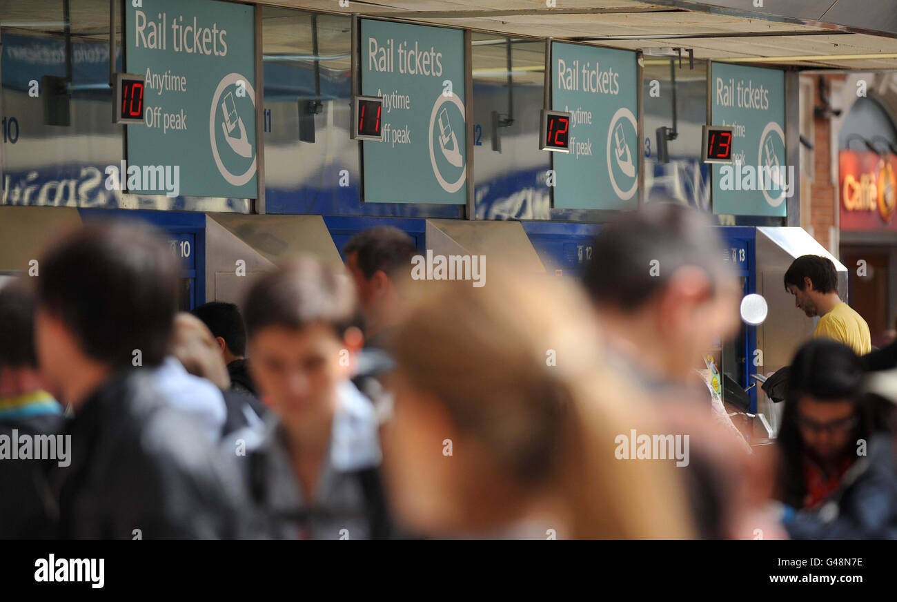 Passengers queue for tickets at Victoria Station in London, during the ...