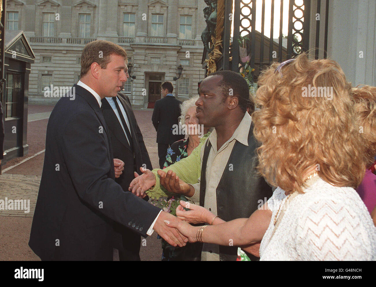 The Duke of York is greeted by wellwishers paying tribute to Diana, Princess of Wales, on his arrival at Buckingham Palace today (Thursday). Photo by John Stillwell/PA Stock Photo