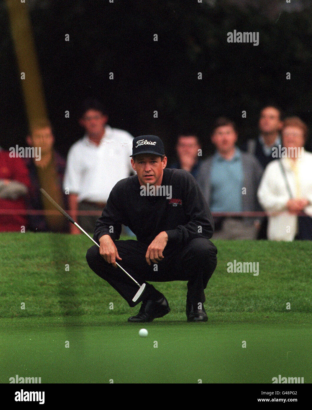 AMERICAN LEE JANZEN. AMERICAN LEE JANZEN LINES UP A PUTT ON THE 1ST