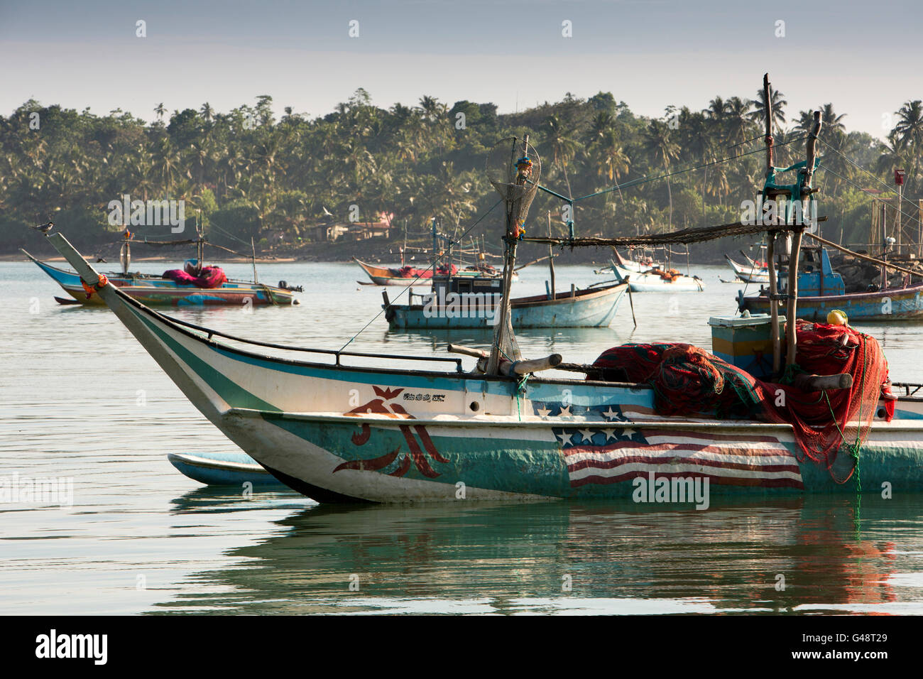 Sri Lanka, Mirissa USA flag painted on fishing boat moored in harbour Stock Photo