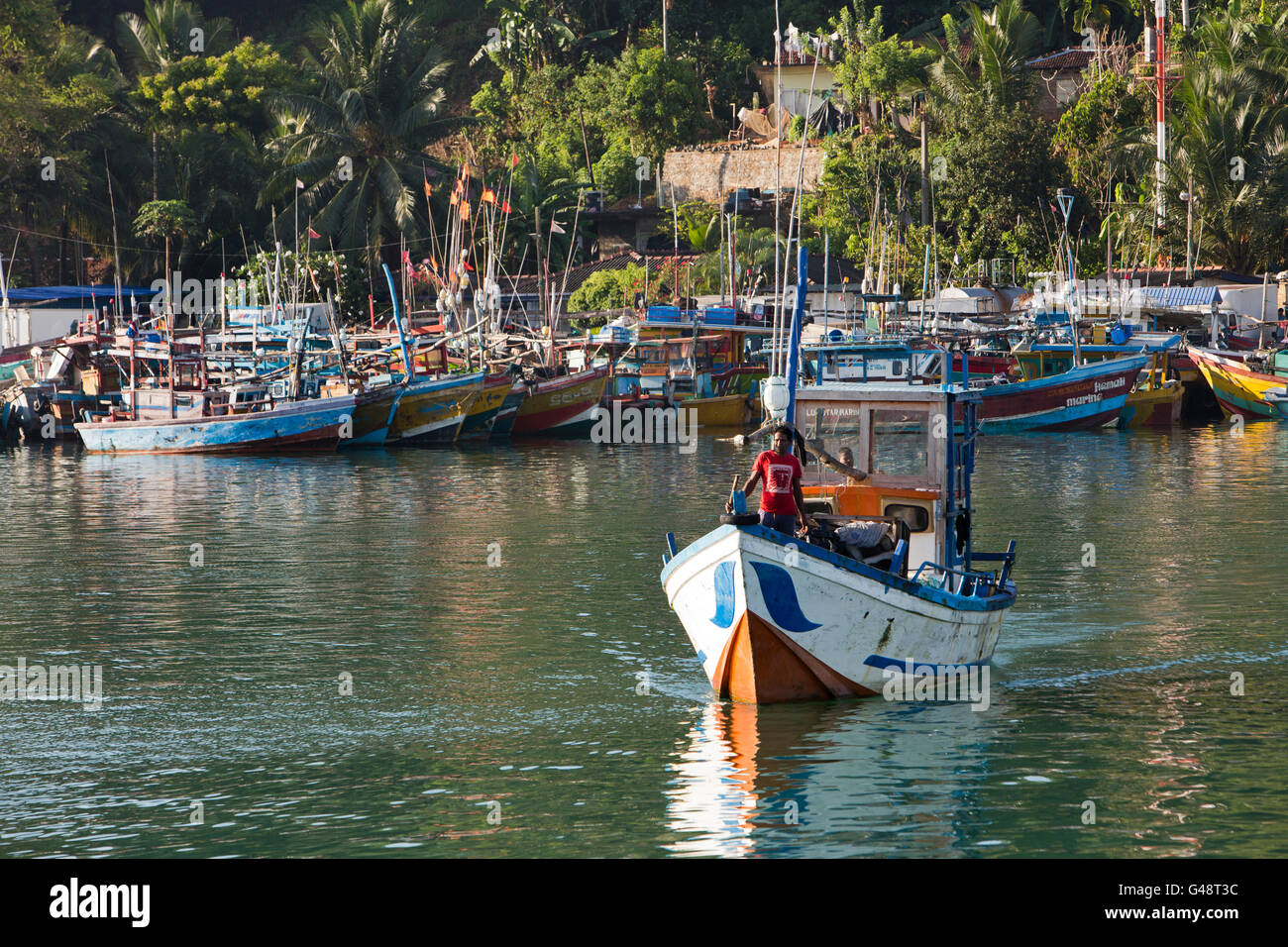 Sri Lanka, Mirissa Harbour, early morning, fishing boat leaving mooring Stock Photo