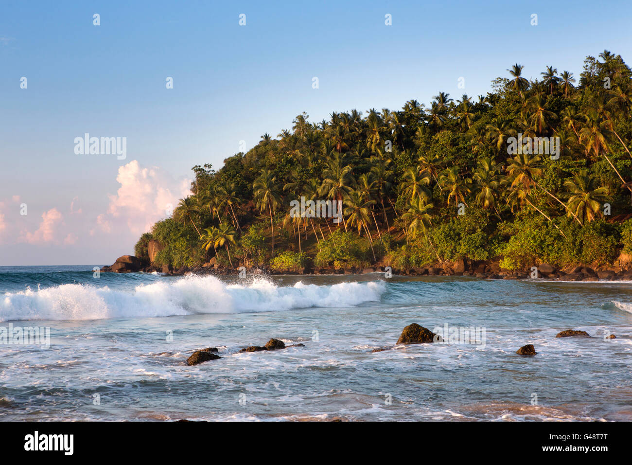 Sri Lanka, Mirissa, early morning waves at western end of beach Stock Photo