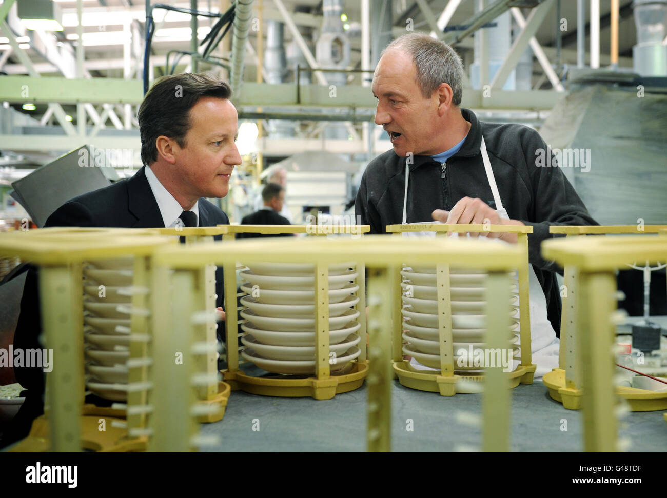 Prime Minister David Cameron meets staff as he tours the Portmeirion Potteries in Stoke-on-Trent today. Later he will make a speech in St Asaph in north Wales. Stock Photo