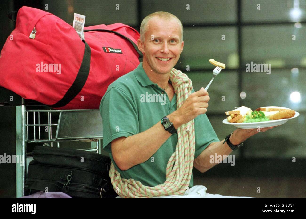 Top mountaineer Alan Hinkes, tucks into his favourite meal, fish and chips,  at Manchester Airport, after returning from the Himalayas today (Monday).  Mr Hinkes, slipped a disc with the violent sneeze caused