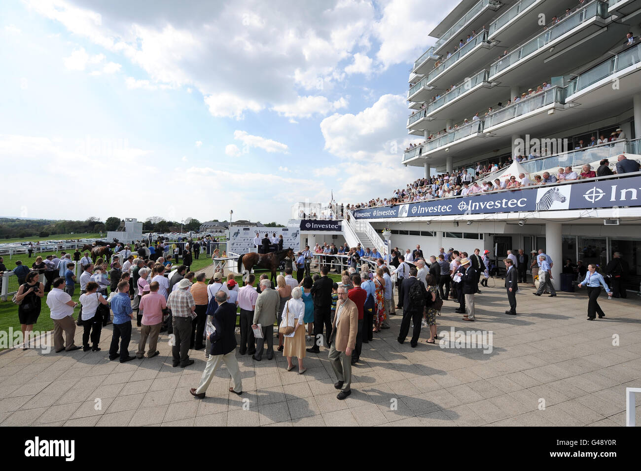 Horse Racing Investec Spring Meeting Epsom Downs Racecourse. Racegoers around the winners