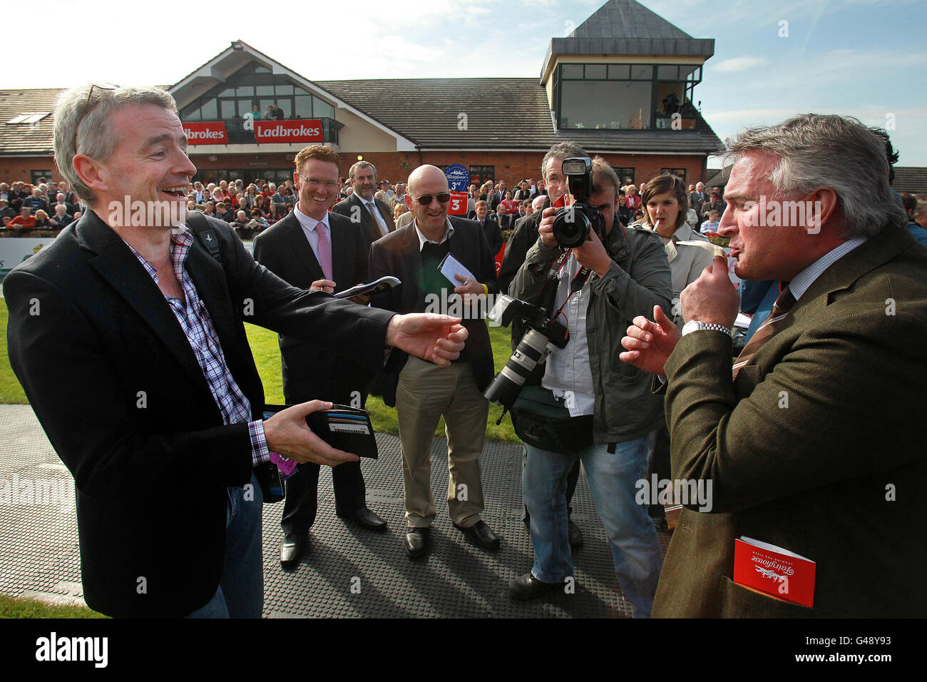 Owner Ronnie Bartlett kisses 50 Euros from Ryanair Chief Executive
