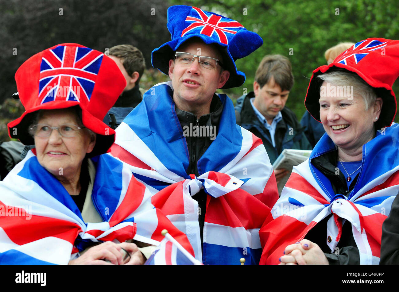People (names not known) gather outside Buckingham Palace, London, on the morning of the royal wedding. Stock Photo