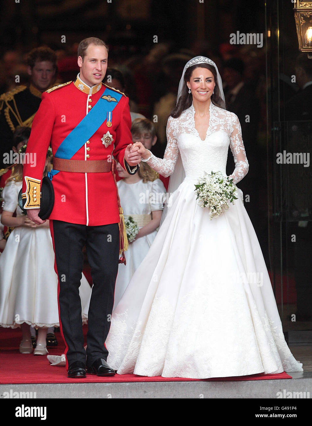 Prince William and his wife Catherine, Duchess of Cambridge emerge from Westminster Abbey after the wedding ceremony. Stock Photo