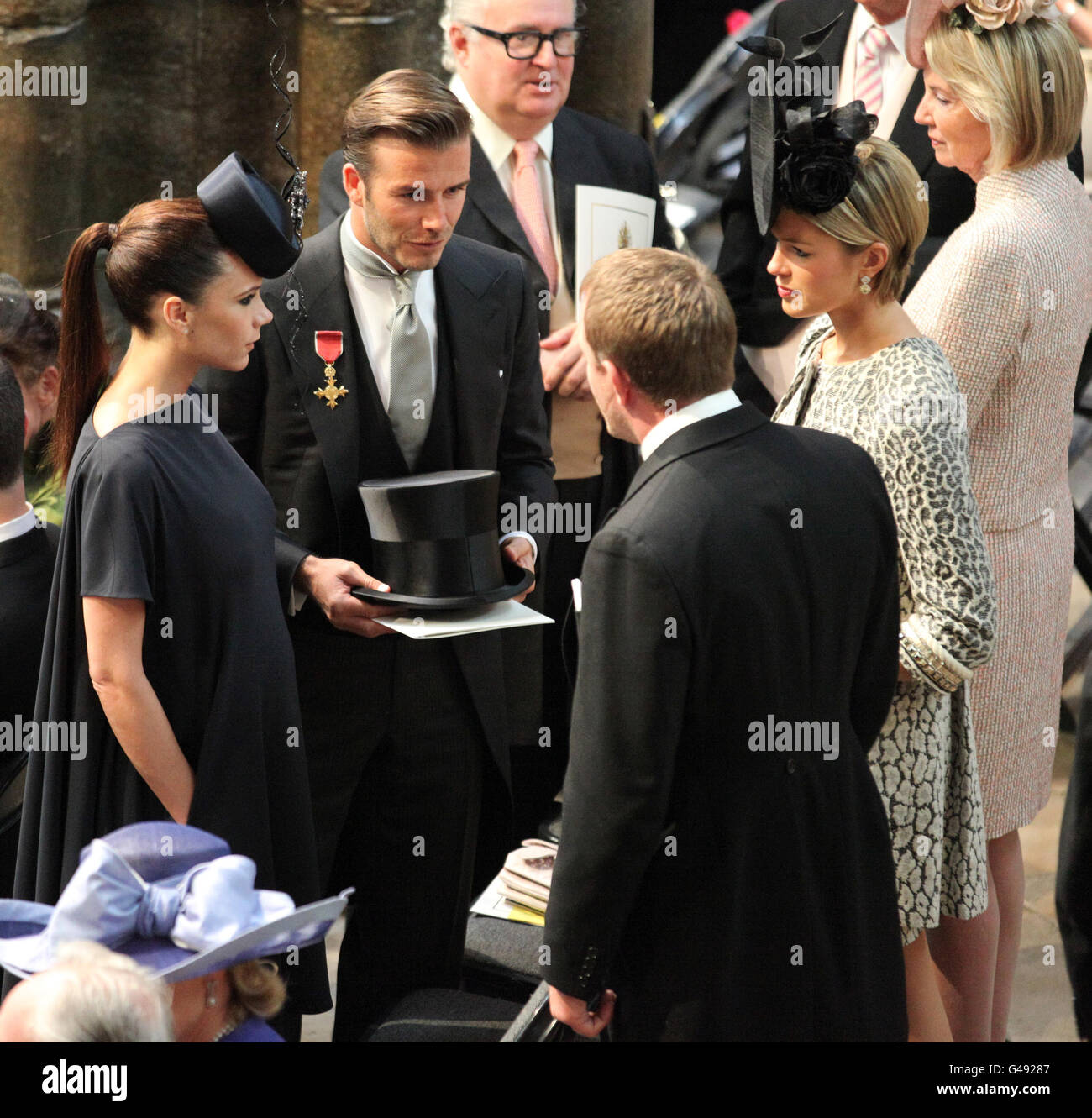 David and Victoria Beckham talk to Guy Ritchie and Isabella Anstruther-Gough-Calthorpe before the wedding of Prince William and Kate Middleton at Westminster Abbey. Stock Photo