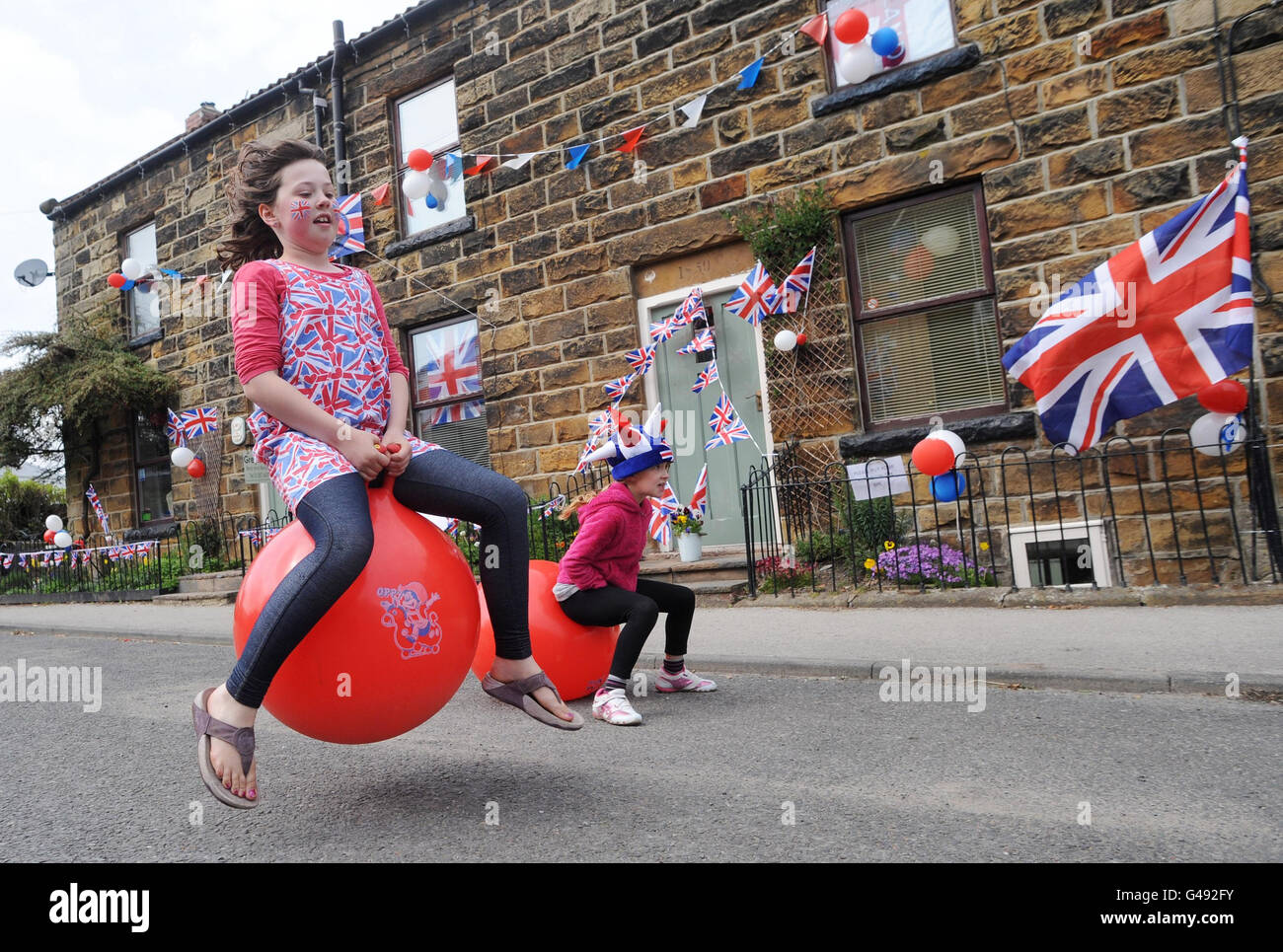 Lily Hood (left) and her friend Emma Snaith, both aged eight, play on