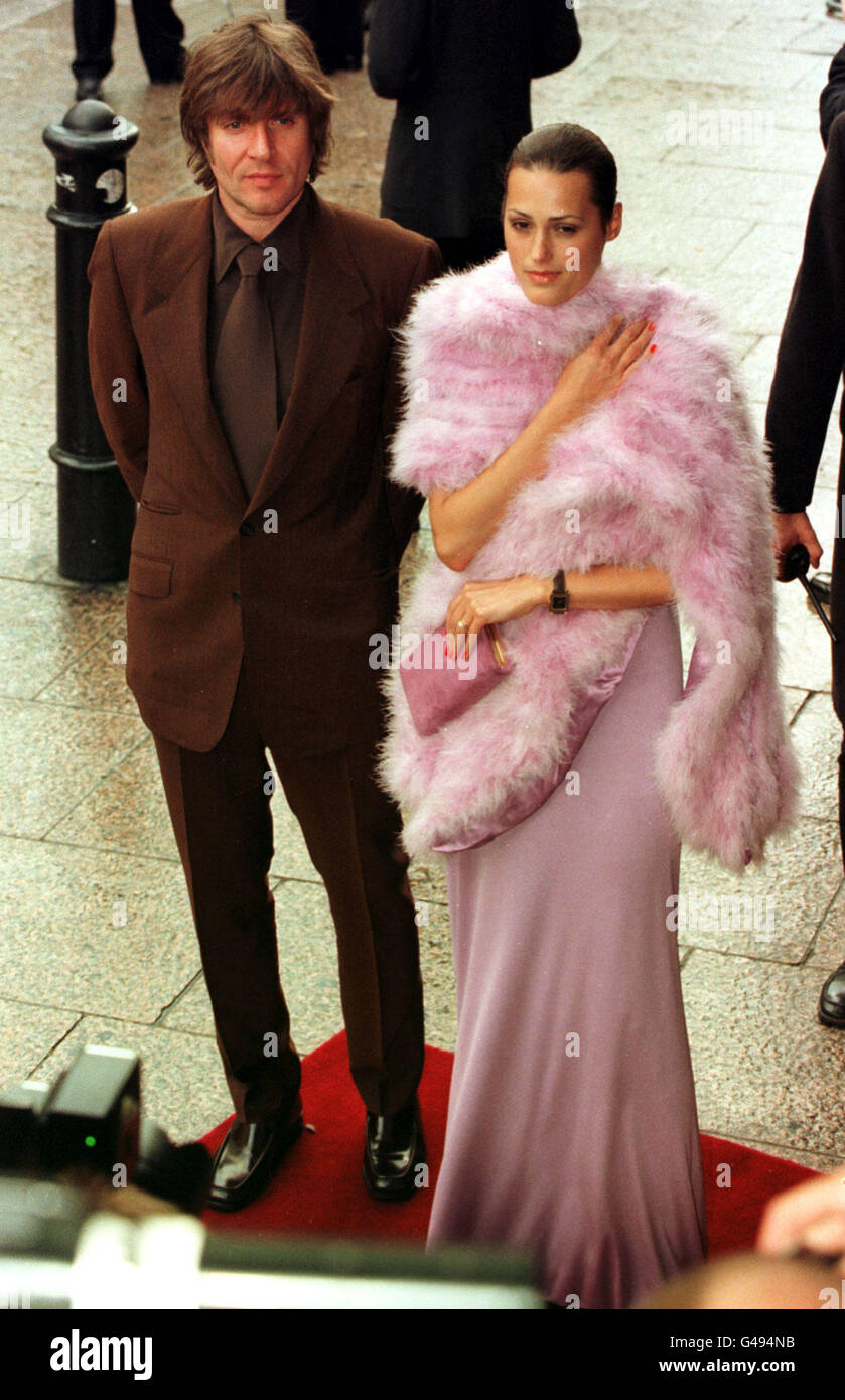 Duran Duran singer Simon Le Bon with his model wife Yasmin attend the premiere of the new Batman and Robin film which stars George Clooney, at the Empire cinema in London's Leicester Square. Stock Photo