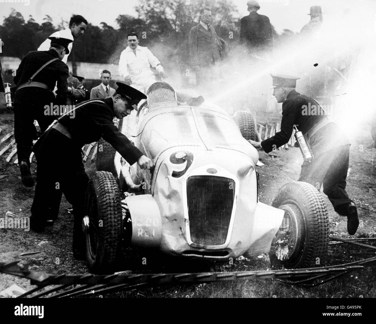 Joseph Paul's Delage catches fire and crashes into the crowd at the International Trophy Race at Brooklands. Stock Photo