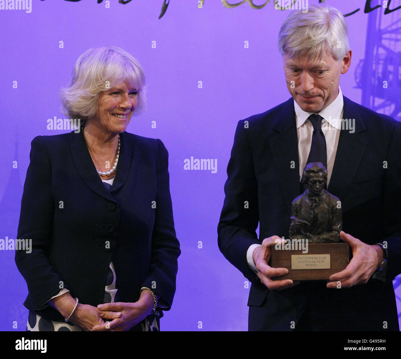 The Duchess of Cornwall presents Bob Tyrer of The Sunday Times with the Scoop of the Year Award at the London Press Club Awards in London. Stock Photo