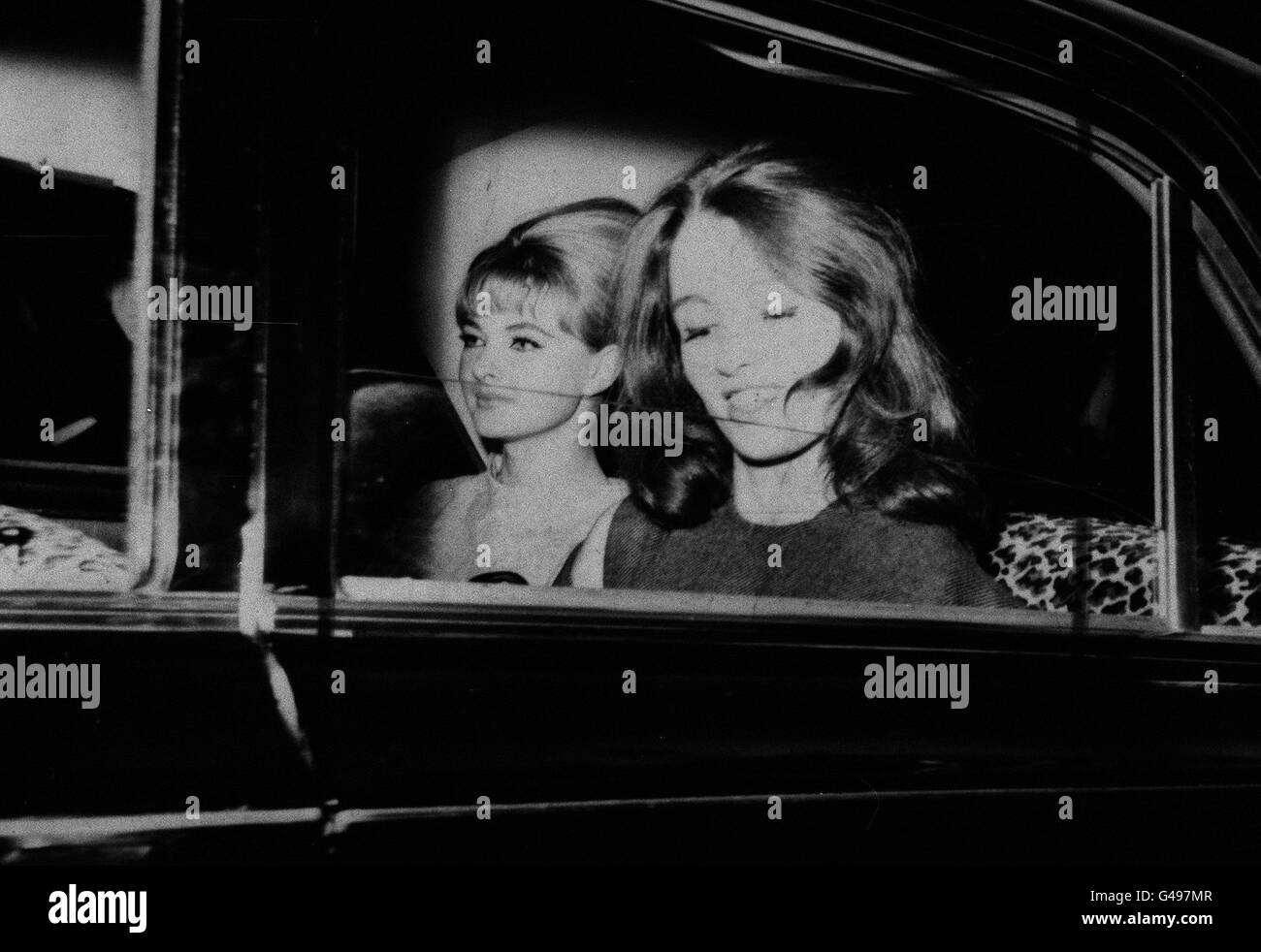 PA NEWS PHOTO 22/7/63 CHRISTINE KEELER AND MARILYN RICE-DAVIES DRIVING AWAY FROM THE OLD BAILEY, LONDON AFTER THE FIRST DAY'S HEARING IN WHICH DR. STEPHEN WARD THE 50 YEAR OLD OSTEOPATH FACES VICE CHARGES. DURING THE HEARING MR. MERVYN GRIFFITH JONES, PROSECUTING GAVE AN UNDERTAKING THAT NO ACTION WOULD BE TAKEN AGAINST HER Stock Photo
