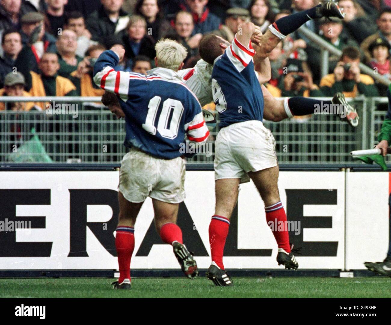 England's David Rees gets a high tackle during their Five Nations match ...