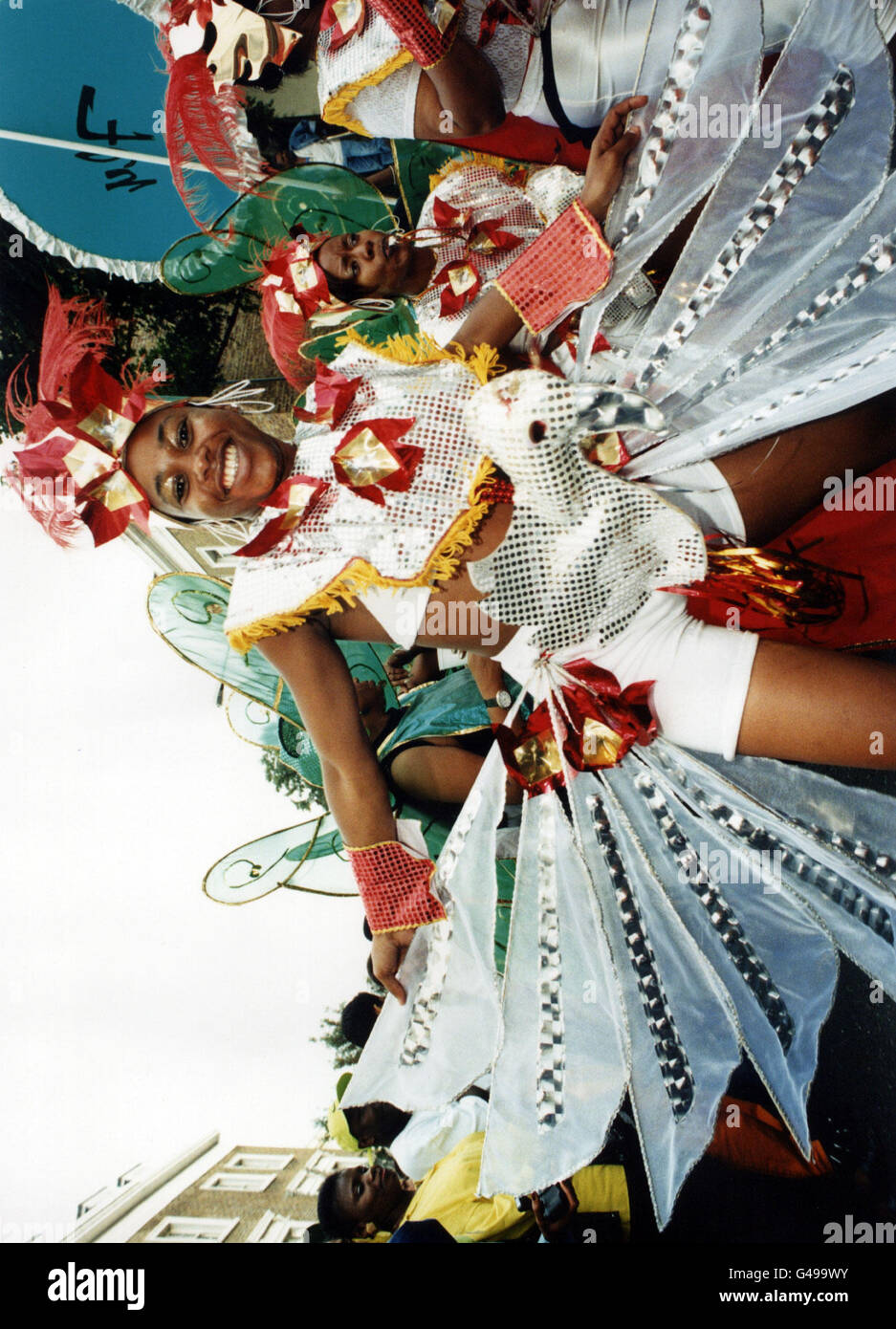 A young woman dresses in costume during the Notting Hill Carnival in London, Europe's largest street festival. Stock Photo