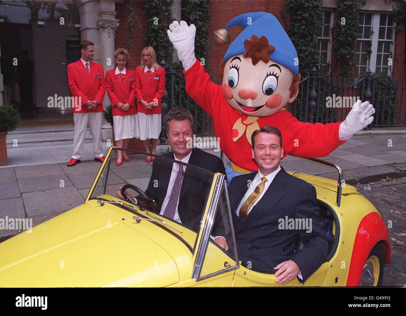 Andrew Teare, chief exec of Rank Group plc (left) and Jerry Fowden, managing director of Rank Holidays with Enid Blyton's Noddy, in London today (Weds) , as the company announced their plans to invest 139 million in Butlins, the most famous name in British holidays. As part of the refurbishment programme, there will be a Noddy and Friends in Toy Town play area built, as the three centres in Minehead, Bognor Regis and Skegness close from January 1998, opening in time for the Summer season in April 1998. Photo by Matthew Fearn. Stock Photo