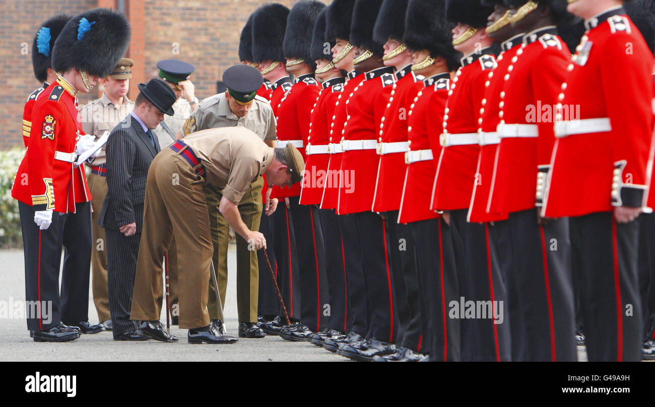 The guardsmen of the Irish Guards are inspected in minute detail by their Commanding Officer Lt Col Chris Ghika (centre) at their barracks in Windsor, as they prepare for their ceremonial duties during the wedding of Prince William and Kate Middleton next week. Stock Photo