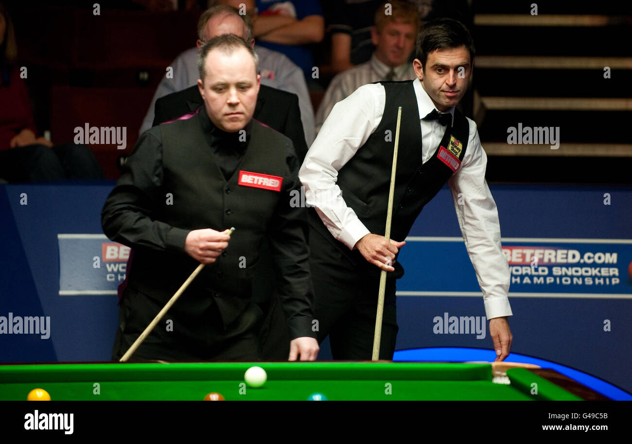 Ronnie OSullivan in action against John Higgins during their quarter final match of the Betfred World Snooker Championships at the Crucible, Sheffield Stock Photo