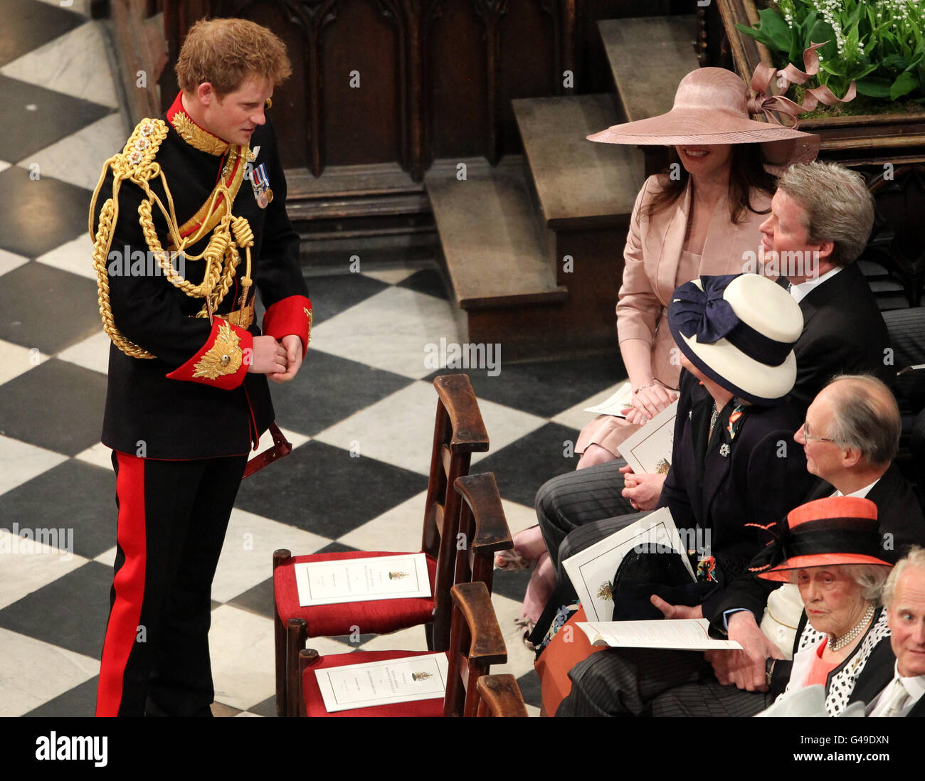 Prince Harry talks to the Earl Spencer shortly after arriving at Westminster Abbey for the wedding of Prince William and Kate Middleton. Stock Photo