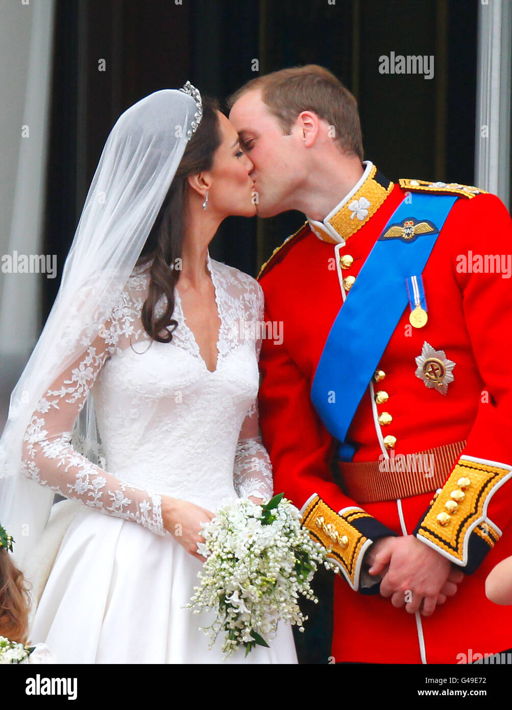Prince William and his wife Kate Middleton, who has been given the title of  The Duchess of Cambridge, kiss on the balcony of Buckingham Palace, London,  following their wedding at Westminster Abbey