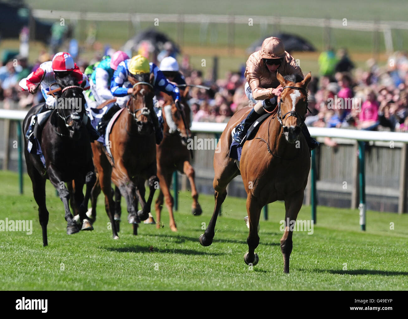Horse Racing - The QIPCO Guineas Festival - Day Two - Newmarket Racecourse. I'm a Dreamer ridden by William Buick (r) surges ahead to win the Qatar Bloodstock Dahlia Stakes Stock Photo